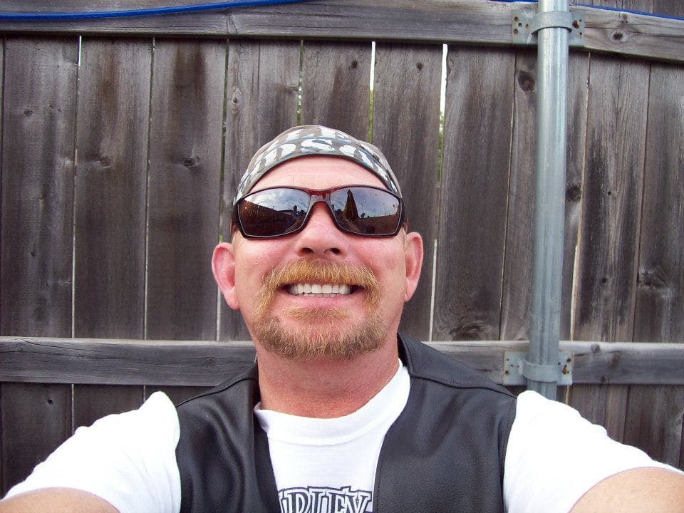 Original photo of a man in a vest